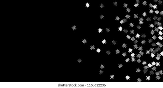 Abstract silver star of confetti. Falling starry background. Random stars shine on a black background. The dark sky with shining stars.  Suitable for your design, cards, invitations, gifts. 