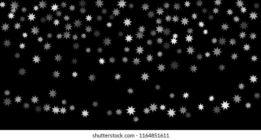 Abstract silver star of confetti. Falling starry background. Random stars shine on a black background. The dark sky with shining stars.  Suitable for your design, cards, invitations, gifts. 
