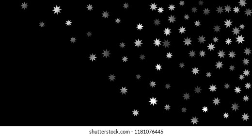 Abstract silver star of confetti. Falling starry background. Random stars shine on a black background. The dark sky with shining stars.  Suitable for your design, cards, invitations, gifts. 