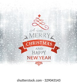 Abstract silver winter, Christmas card with snowflakes, snowfall, out of of focus light dots, stars and light effects and the wording Merry Christmas and Happy New Year. Copy space