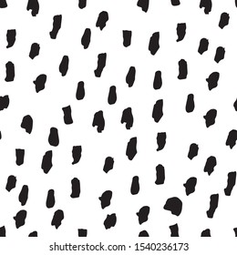 Abstract simple trendy seamless pattern.  Black and white.  Brush strokes, different spots, hand drawn in doodle style. Modern textile, packaging, wrapping paper.