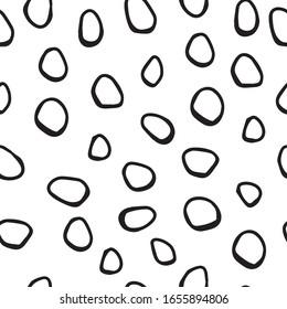 Abstract simple trendy seamless pattern.  Black and white.  Brush strokes, different oval spots, hand drawn in doodle style. Modern textile, packaging, wrapping paper.