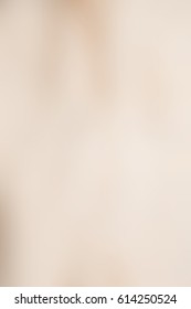 Abstract smooth blur beige background for any design to put over. Vertical format.