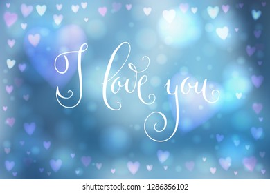 Abstract smooth blur blue background with heart-shaped lights over it and hand written I love you words.