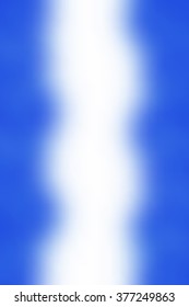 Abstract smooth blur blue and white background for any design to put over. Vertical format.