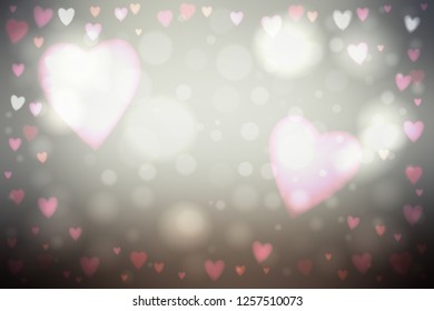 Abstract smooth blur gray background with heart-shaped pink lights over it.