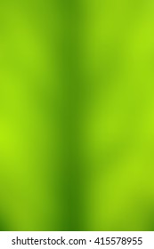 Abstract smooth blur green background for any design to put over. Vertical format.