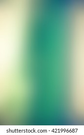Abstract smooth blur green background for any design to put over. Vertical format.