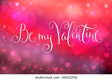 Abstract smooth blur pink background with heart-shaped lights over it and hand written Valentine's day greetings.