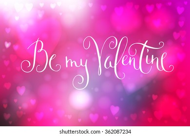 Abstract smooth blur pink background with heart-shaped lights over it and hand written Valentine's day greetings.