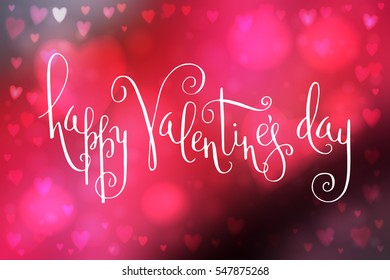 Abstract smooth blur pink background with heart-shaped lights over it and hand written Valentine's day greetings.