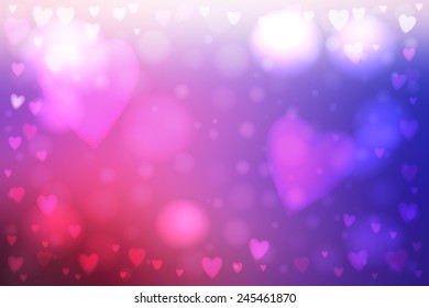 Abstract smooth blur pink and blue background with heart-shaped lights over it.