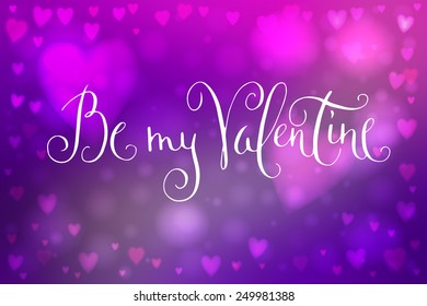 Abstract smooth blur purple background with heart-shaped lights over it and hand written Valentine's day greetings.