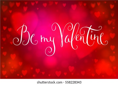 Abstract smooth blur red background with heart-shaped lights over it and hand written Valentine's day greetings.