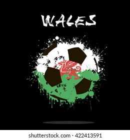 Abstract soccer ball painted in the colors of the Wales flag. Vector illustration 