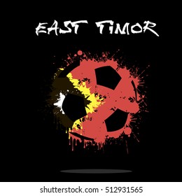 Abstract soccer ball painted in the colors of the East Timor flag. Vector illustration