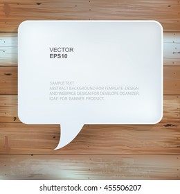 Abstract speech bubble symbol on vintage wood texture background.