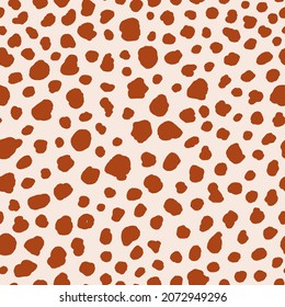 Abstract spot animal skin seamless repeat pattern. Random placed, irregular vector stains all over surface print on beige background.