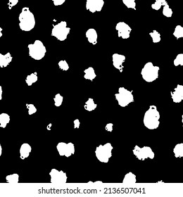Abstract spot seamless pattern. Dalmatian leopard grunge spots. Paint dirty spotted grunge pattern. Vector hand drawn illustration isolated on black background.