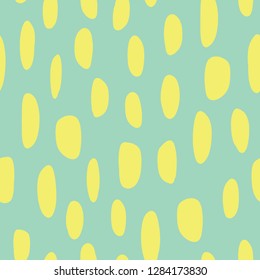 Abstract spot shapes seamless vector pattern. Yellow lime marks on green background. Modern strokes design for fabric, packaging , digital paper, web banner, page fill, wrapping, covers