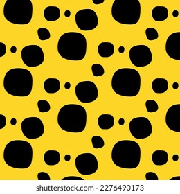 Abstract spots black on a yellow background.