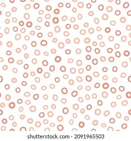 Abstract spotted seamless pattern in pastel colors. Beige dotted background. Vector hand-drawn illustration. Perfect for print, decorations, wrapping paper, covers, invitations, cards.