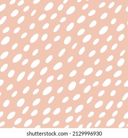 Abstract spotted seamless pattern in pastel colors. Beige dotted background. Vector hand-drawn illustration. Perfect for print,  decorations, wrapping paper, covers, invitations, cards.
