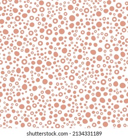 Abstract spotted seamless pattern in pastel colors. Brown dotted background. Vector hand-drawn illustration. Perfect for print, decorations, wrapping paper, covers, invitations, cards.