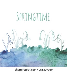 Abstract spring blue watercolor background with snowdrops