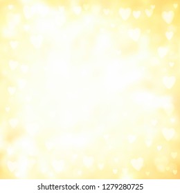 Abstract square blur light yellow background with small heart-shaped lights over it.