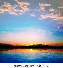 abstract sunrise background with forest lake and blue sky