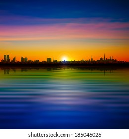 abstract sunset background with silhouette of Tallinn and pink clouds