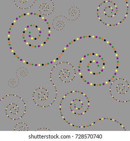Abstract swirls background in a dashed line - swirls in a traditional Halloween colors of orange, black, green, yellow and purple over a gray background. Seamless repeating pattern