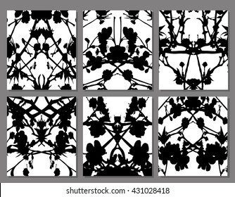 Abstract symmetrical black stains on a white background, set
