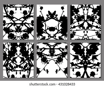 Abstract symmetrical black stains on a white background, set