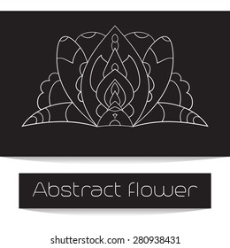 Abstract symmetrical flower of fine lines on dark background.