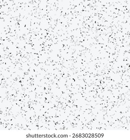 Abstract terrazzo seamless pattern with scattered stone chips in gray and black tones on white background texture.