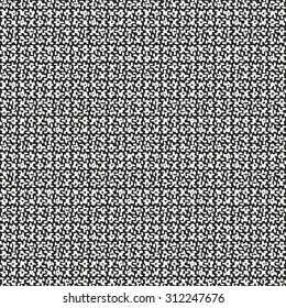 Abstract textile surface in black and white flecks. Seamless pattern.