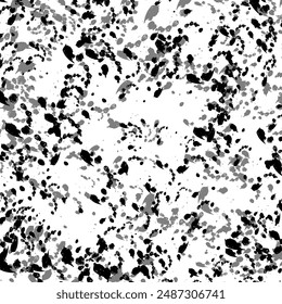 Abstract texture of black mascara splatters on a white background.