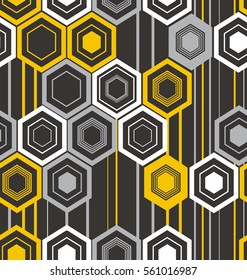 Abstract texture of hexagons in black, yellow, white and gray colors on a black background. 