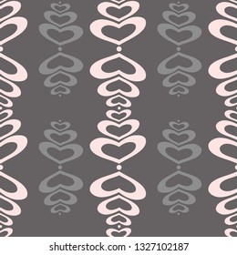 Abstract texture with pink and gray hearts on brown background.