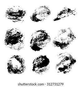 Abstract texture smears of black paint spots on white paper 1