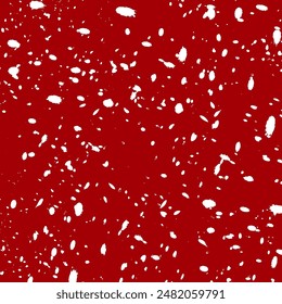 Abstract texture of white splashes on a red background.