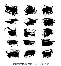 Abstract textured black hand-drawn brush strokes isolated on a white background