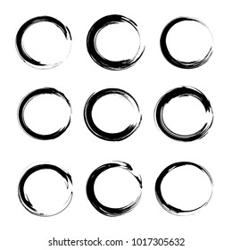 Abstract textured black hand-drawn circle thin brush strokes isolated on a white background
