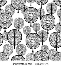 Abstract trees seamless pattern, stylized forest, vintage vector monochrome drawing. Ornate black tree trunks with branches and crown foliage on white background. For fabric design, print, wallpapers