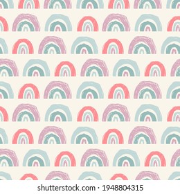 Abstract trendy rainbows pattern in doodle or scribble style as a seamless texture for surfaces design for children. Colorful vector illustration