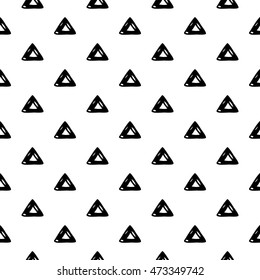 Abstract triangle pattern with hand drawn ink triangles. Cute vector black and white triangle pattern. Seamless monochrome doodle triangle pattern for fabric, wallpapers, wrapping paper and cards.