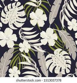 Abstract tropical seamless background with white flowers and plants on black background. Summer background with exotic leaves. Beautiful seamless vector floral pattern.