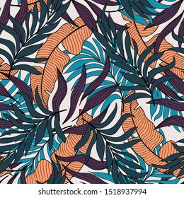 Abstract tropical seamless pattern with colorful exotic flowers and plants in dark color on light background. Tropic leaves in bright colors. 
Seamless exotic pattern with tropical plants.